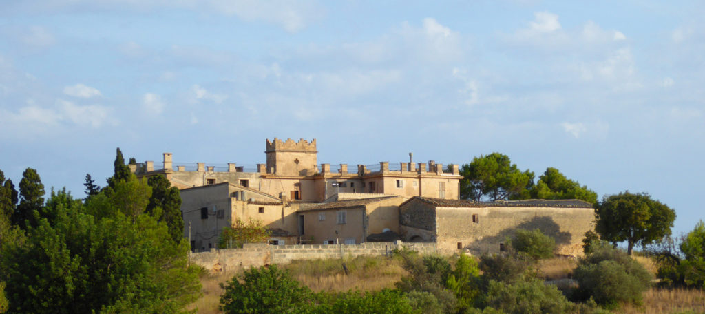 Photo of a stone finca on top of a hill